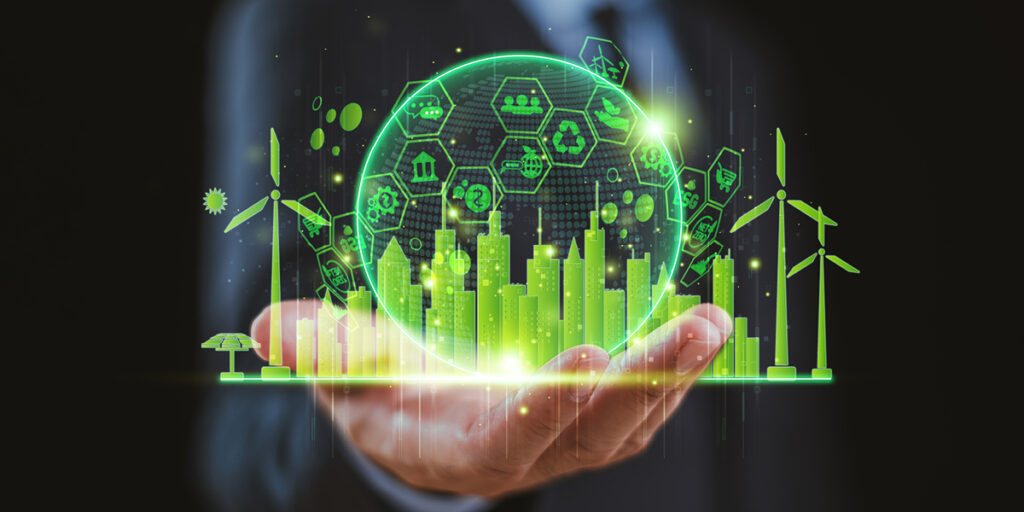 Person hold a green globe with sustainability related icons